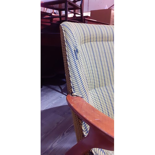 86K - A Swedish armchair with yellow and blue upholstery. 
The chair and the cushion are sprung. The cushi... 