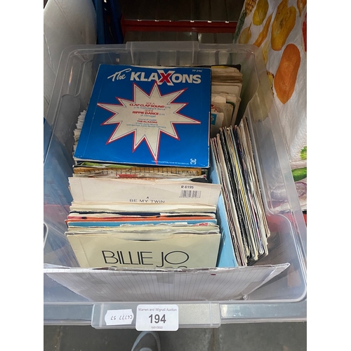 194 - A box of assorted 45s.