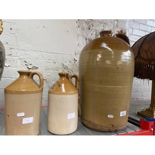 209 - A large stoneware flagon and 2 small ones.