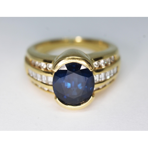 122 - A sapphire and diamond ring, the central oval mixed cut sapphire weighing approx. 3.90 carats, diamo... 