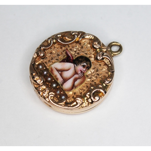 130 - An antique locket, scroll border surrounded a central enamel winged cherub above a single row of pea... 