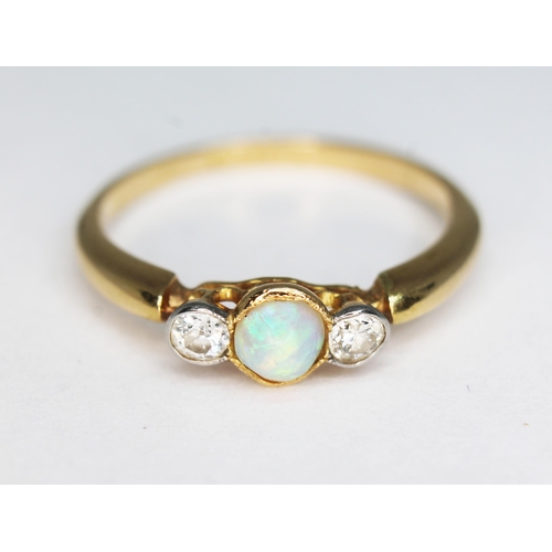 145 - A precious opal and diamond ring, marks rubbed, gross wt. 2.55g, size P.