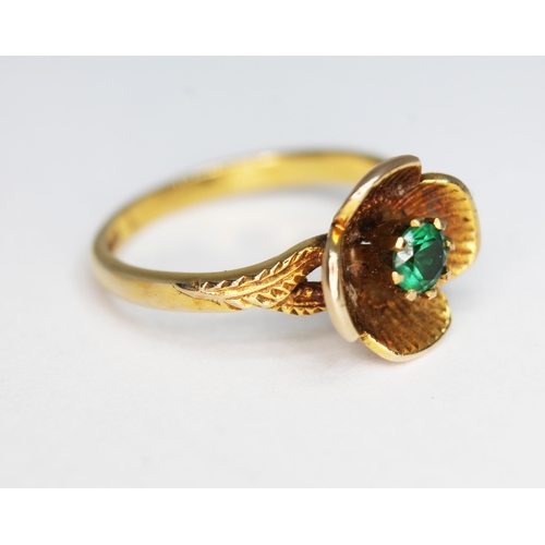 151 - A hallmarked 9ct gold ring, modelled as a flower and set with a green garnet, gross wt. 2.54g, size ... 