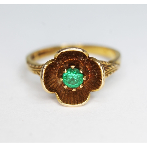 151 - A hallmarked 9ct gold ring, modelled as a flower and set with a green garnet, gross wt. 2.54g, size ... 