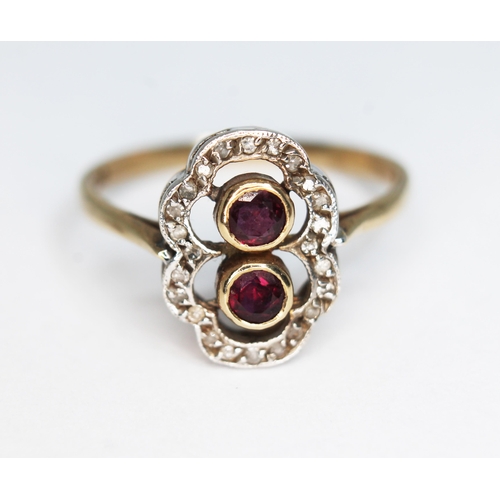 157 - A ruby and diamond cluster ring, the cluster measuring approx. 14mm x 10mm, marked '9c', gross wt. 2... 