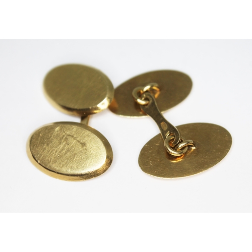 169 - A pair of yellow metal cufflinks, marked '750', wt. 16.09g.