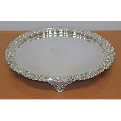 199 - An Edward VII silver salver, shell and scroll border and stood on three feet, Hawksworth, Eyre & Co ... 