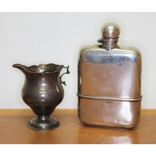 204 - Hallmarked silver comprising a hip flask and an 18th century jug, both as found, gross wt. 8 1/2oz.