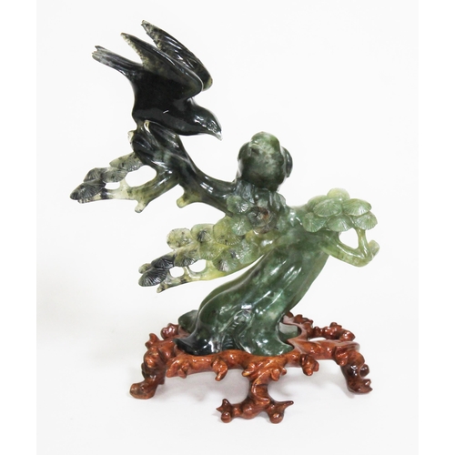 207 - A Chinese spinach jade carving depicting two birds sat amongst a flowering prunus tree, carved woode... 