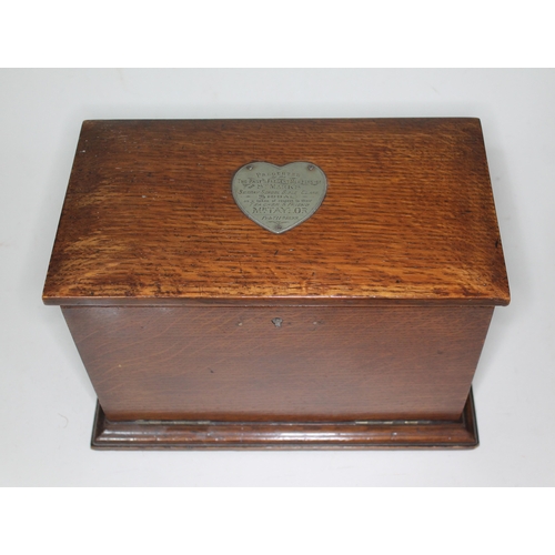 26 - A late Victorian oak desk tidy with writing slope and gothic style handles, bearing heart shaped pre... 