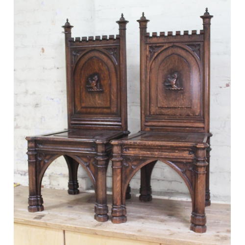 43 - A pair of mid 19th century Gothic oak hall chairs in the manner of AWN Pugin, architectural design w... 