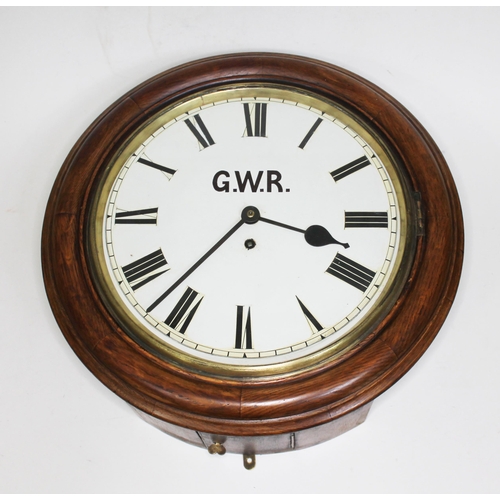 57 - An oak cased round fusee wall clock, the repainted dial bearing 'G.W.R', diam. 41.5cm.