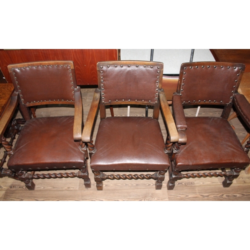 6 - A set of nine early 20th century oak armchairs with twist supports.