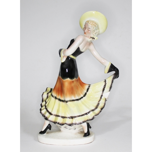 217 - A Goldscheider style Art Deco figure of a woman in stylised pose, the base stamped 35293, height 28.... 