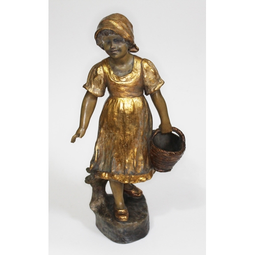 220 - A Goldscheider terracotta and gilt highlighted figure of a girl holding a basket by B. Haniroff, sta... 