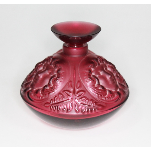 228 - A Lalique Flacon Psyche Rouge pressed glass scent bottle, 8.5cm, with box.