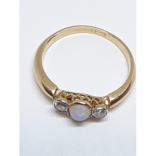 145 - A precious opal and diamond ring, marks rubbed, gross wt. 2.55g, size P.