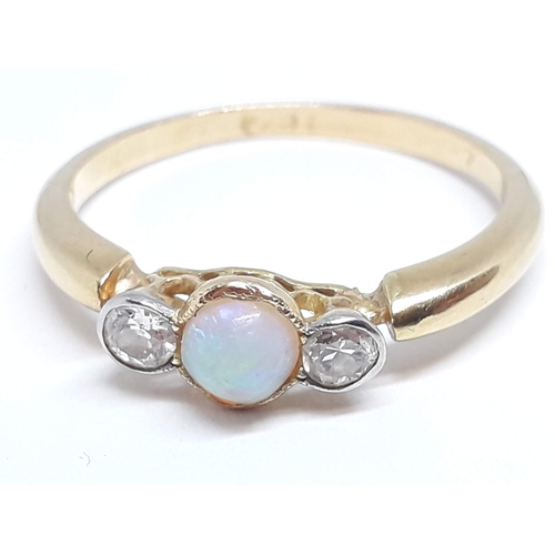 145 - A precious opal and diamond ring, marks rubbed, gross wt. 2.55g, size P.