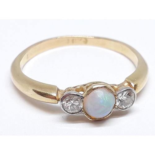 145 - A precious opal and diamond ring, marks rubbed, gross wt. 2.55g, size P.