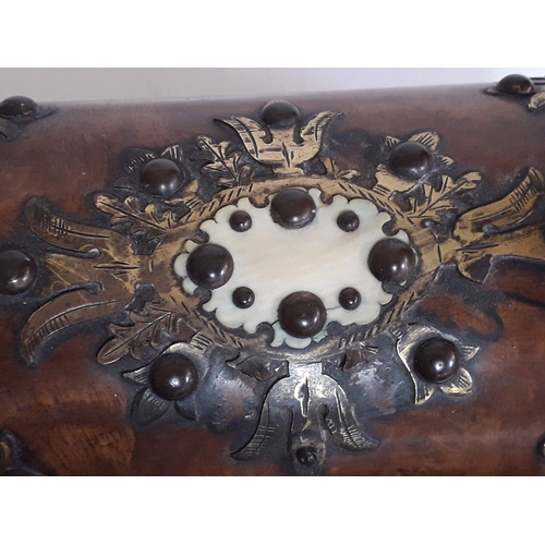 41 - A 19th century ivory, gilt metal mounted and studded domed walnut casket, length 20cm.