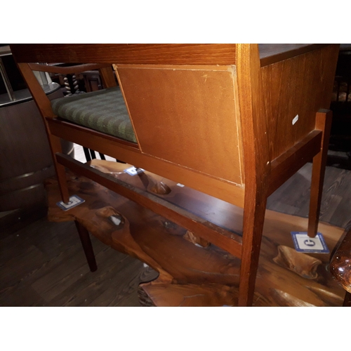 14 - A retro mid 20th century teak telephone seat by Chippy Heath, width 92cm.