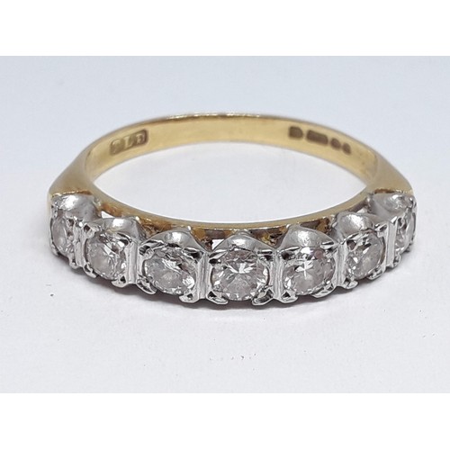 165 - A seven stone diamond ring, total approx. diamond wt. 0.63 carats, hallmarked 18ct gold band, gross ... 