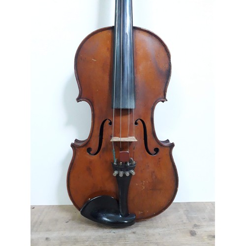 134 - An antique violin, two piece back, with two bows and hard case.