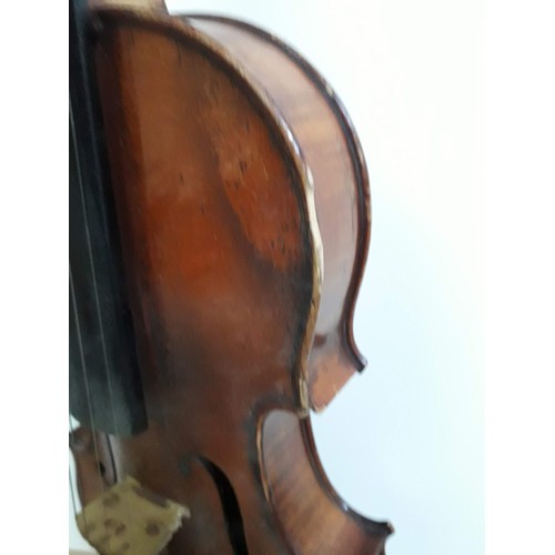 134 - An antique violin, two piece back, with two bows and hard case.