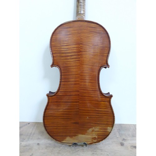 134 - An antique violin, two piece back, with two bows and hard case.