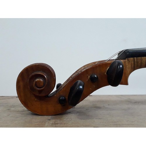 134 - An antique violin, two piece back, with two bows and hard case.