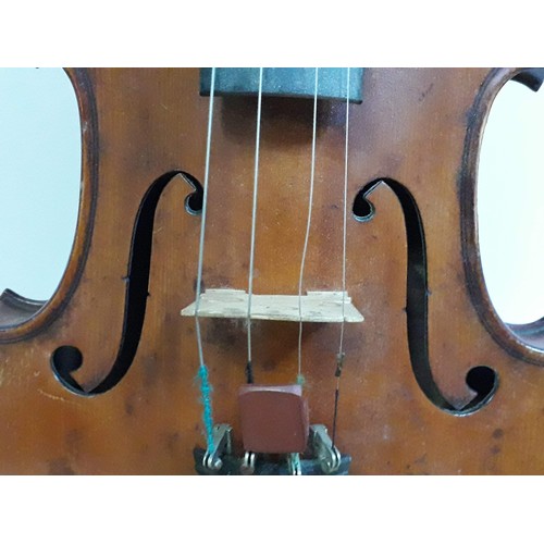 134 - An antique violin, two piece back, with two bows and hard case.