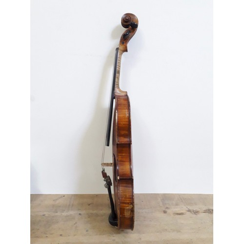 134 - An antique violin, two piece back, with two bows and hard case.