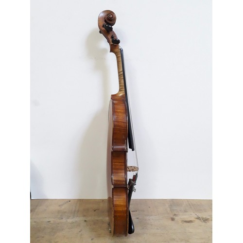 134 - An antique violin, two piece back, with two bows and hard case.