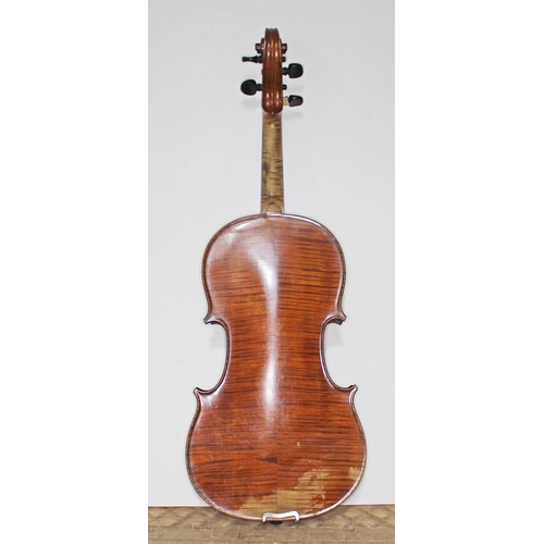 134 - An antique violin, two piece back, with two bows and hard case.