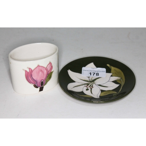 178 - A small Moorcroft cream with pink vase and a small Moorcroft green plate / saucer.