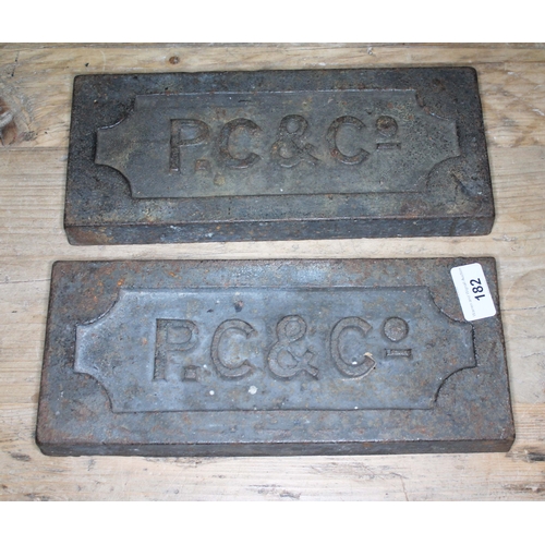 182 - A pair of cast work plates 'P.C & Co'.