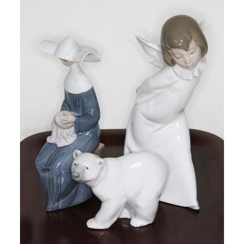 78 - Three Lladro figures. Curious Angel 4960; Time to Sew (Blue) 5501; Attentive Polar Bear 1207. Box fo... 