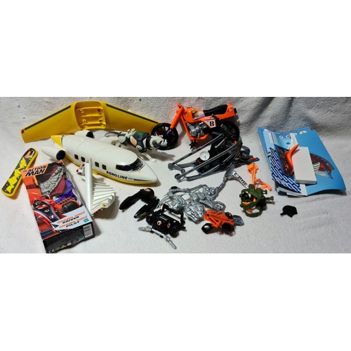 254 - A box of misc toys to include Action Man, Playmobil, etc.