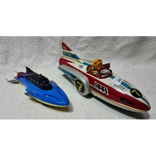 260 - A vintage 1960's tin flying boat / spaceship with tin friction mechanism MF-742 and a vintage Stingr... 