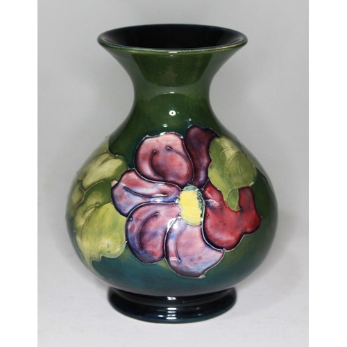 380 - A Moorcroft pottery vase, paper label to base, height 13cm.