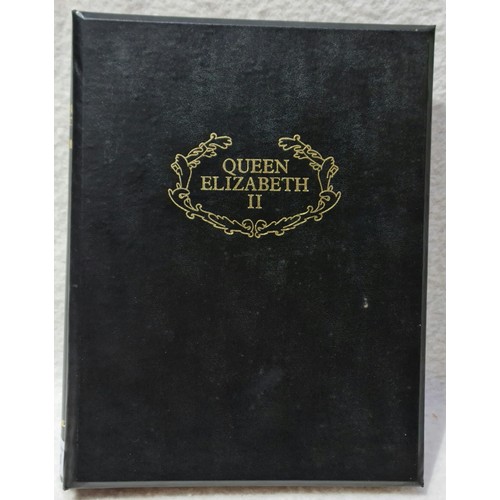 64 - Queen Elizabeth II coin album, sparsely filled.