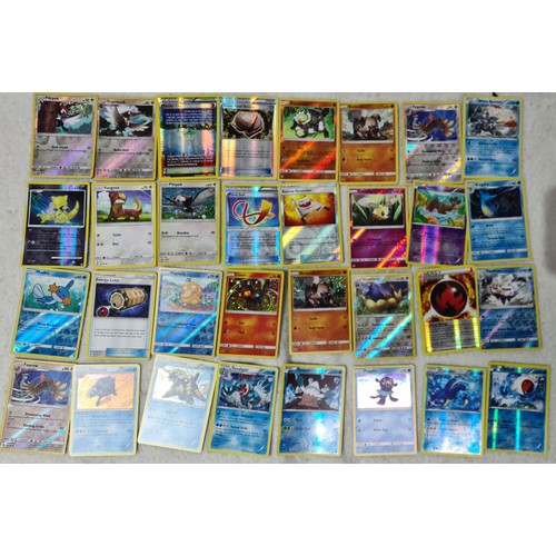 264 - A large collection of Pokemon cards, metal discs and tins. sold as found no returns.