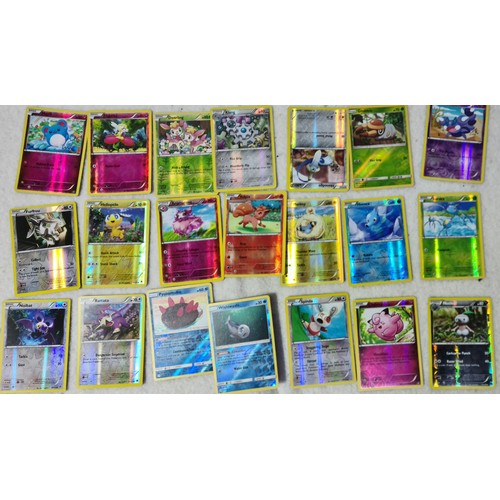 264 - A large collection of Pokemon cards, metal discs and tins. sold as found no returns.