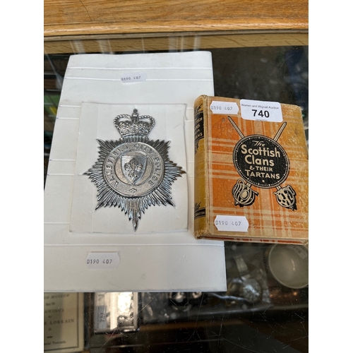 740 - A Wakefield City Police helmet badge and a book 'The Scottish Clans and their Tartans'