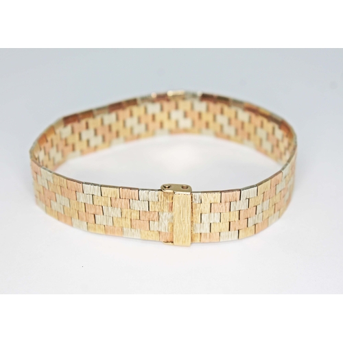 145 - A textured three colour 9ct gold brick link bracelet, sponsor's mark 'RCK', London 1976, length 17.5... 