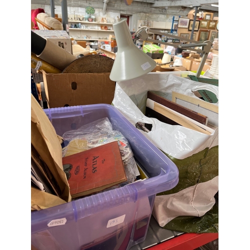 193 - A box of assorted stamps, a bag of Queen Elizabeth ephemera and an angle lamp.