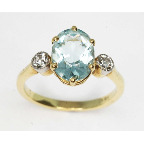 102 - An aquamarine and diamond ring, the central six claw set oval cut stone weighing approx. 1.77ct, mou... 