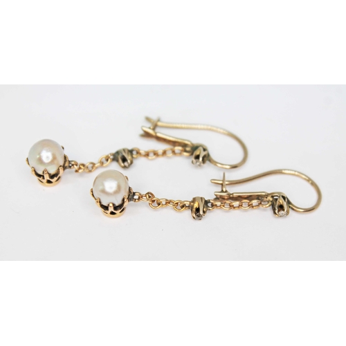 104 - A pair of antique pearl and diamond drop earrings, each split pearl measuring approx. 5.95mm in diam... 