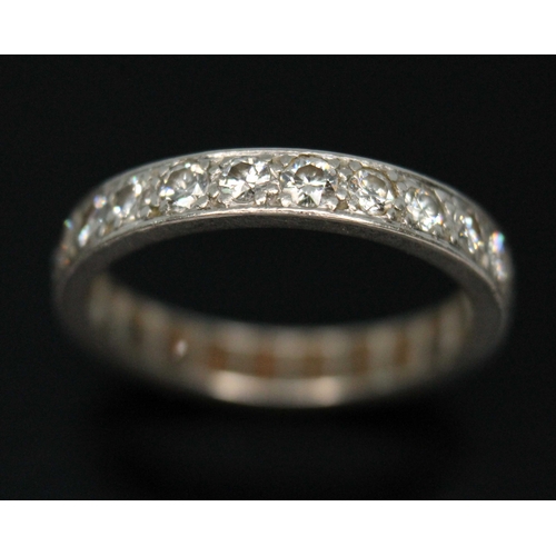 109 - An early 20th century diamond eternity ring, twenty four round transitional cut diamonds  weighing a... 