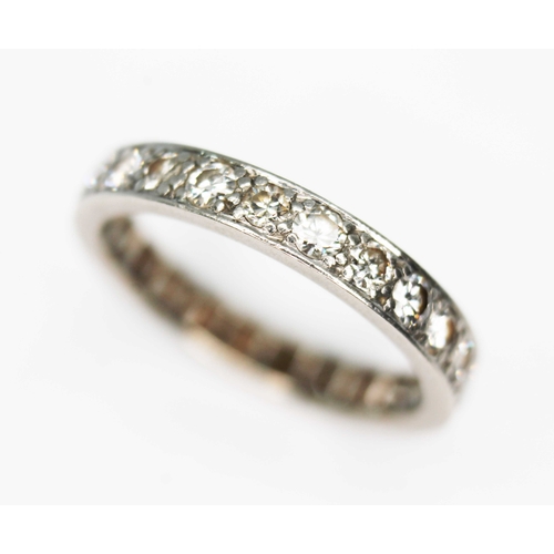 109 - An early 20th century diamond eternity ring, twenty four round transitional cut diamonds  weighing a... 